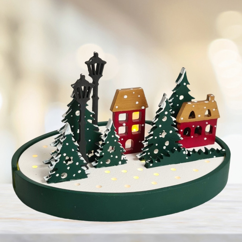 Weihnachtslandschaft mit Teelichtern